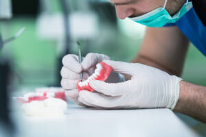 Dentist Working On Dentures